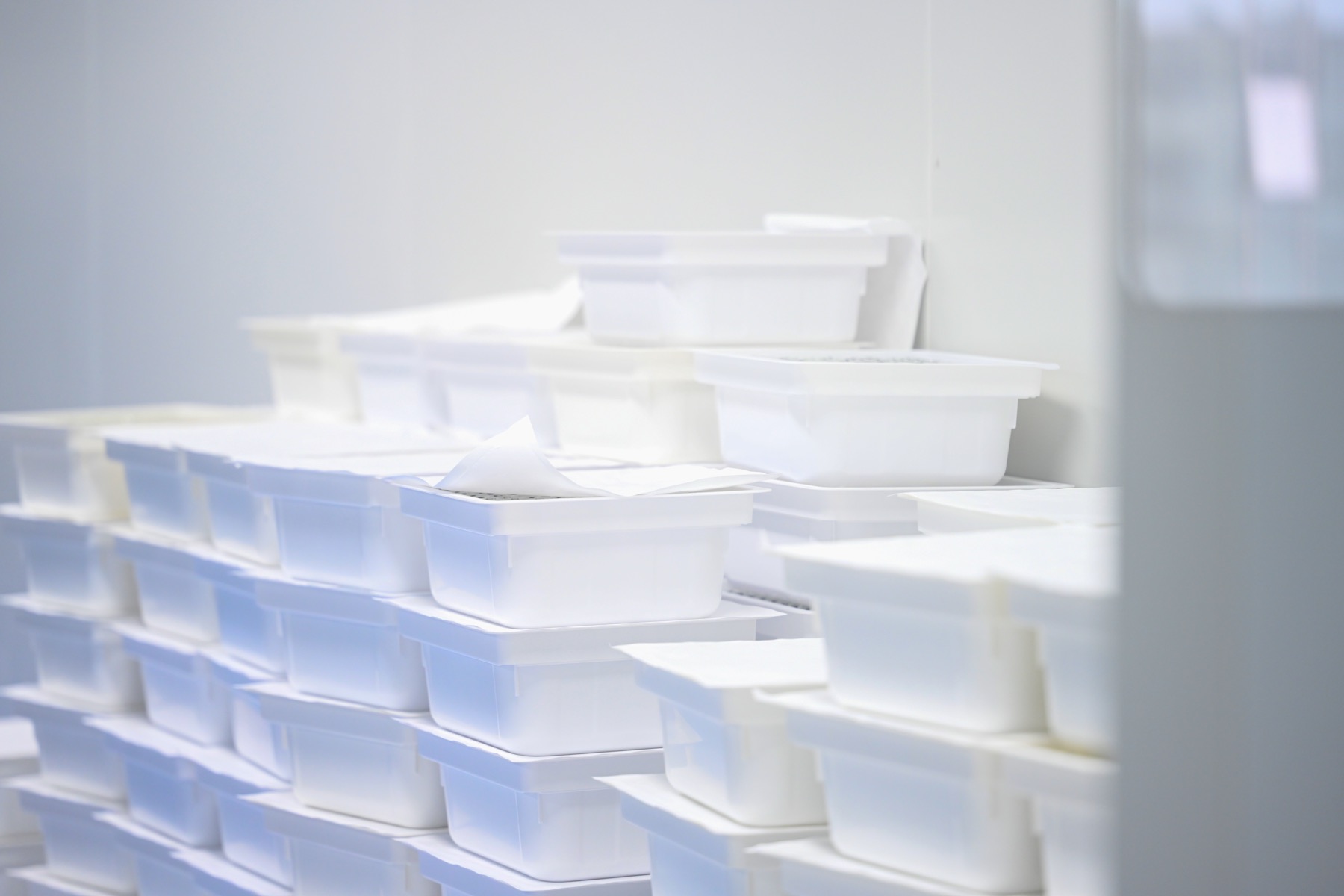 Plastic components prepared in clean production containers